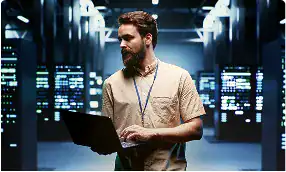 Cloud migration expert working on system transfer in a data center