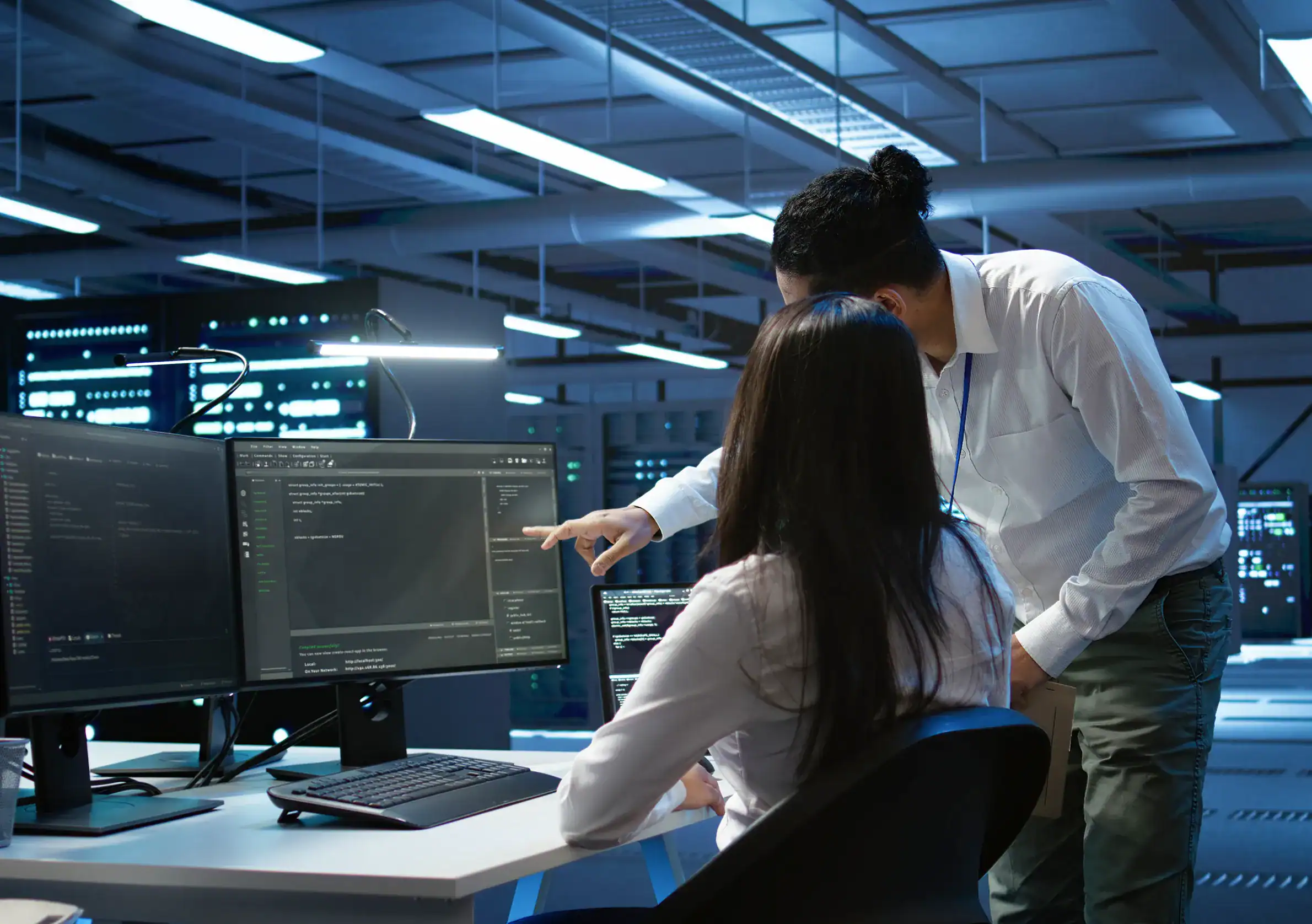 Managed detection and response analysts collaborating to monitor and respond to cyber threats