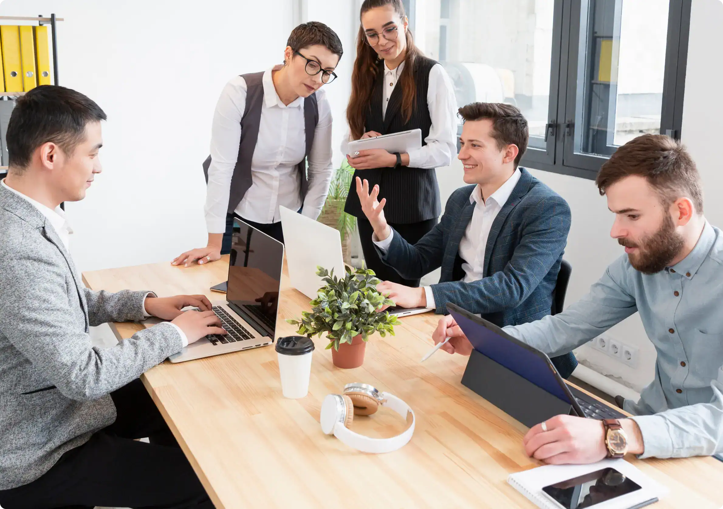 Outsourcing IT services consultants in a meeting