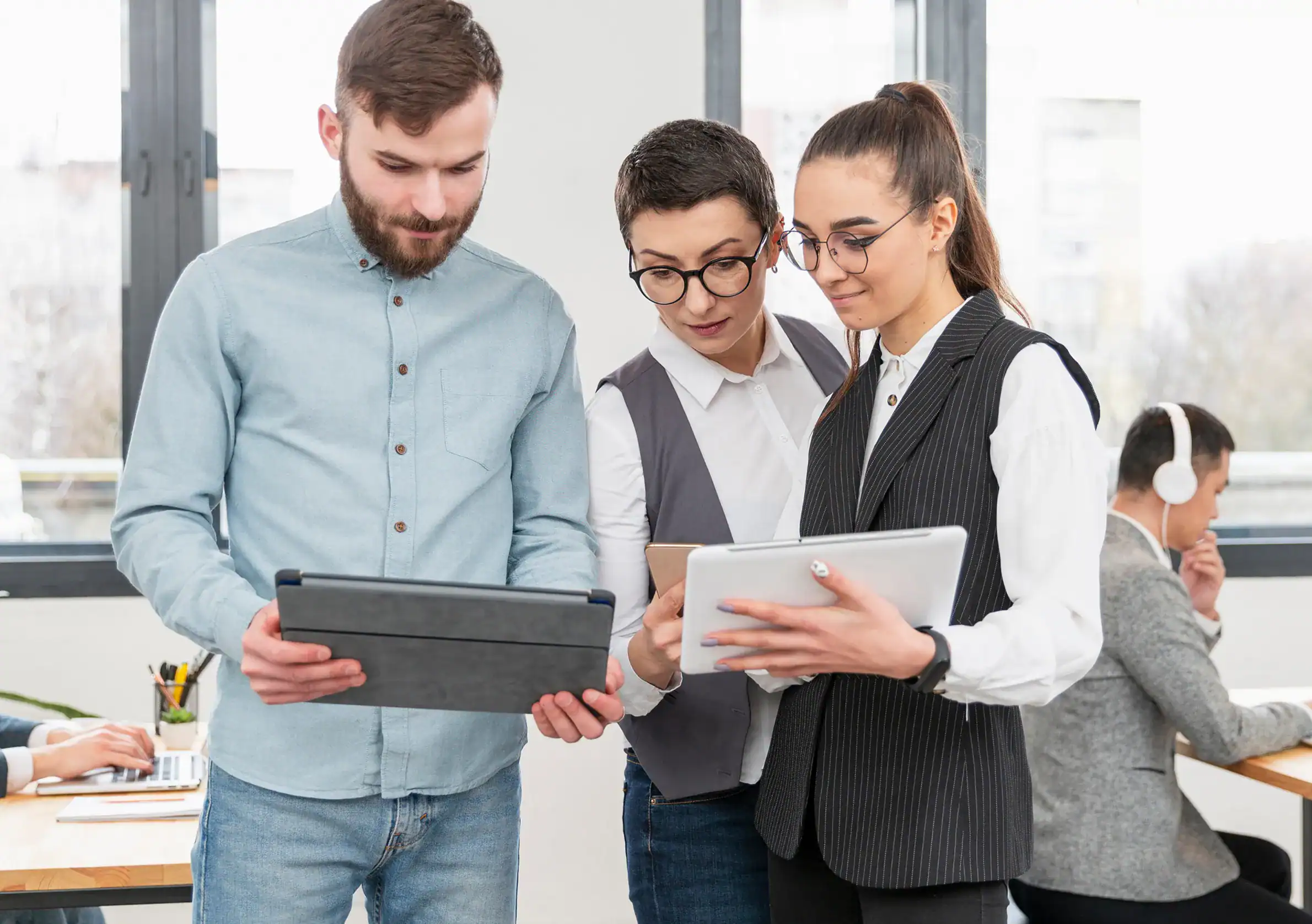 Team collaborating to design and implement enterprise web development services for the enterprise